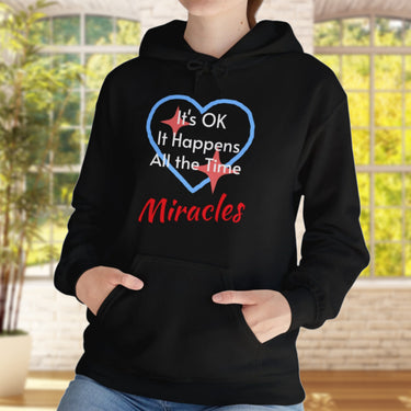 Gildan unisex hoodie with “Miracles Happen” design and uplifting message, Christian apparel made from soft cotton-poly blend, ideal for cooler weather and faith-inspired comfort, black hoodie